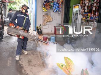 Health officials in the field of public environment carry out fumigation of the environment on residents in Grinding, Jakarta on March 29, 2...