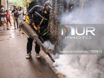 Health officials in the field of public environment carry out fumigation of the environment on residents in Grinding, Jakarta on March 29, 2...