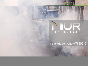 Health officials in the field of public environment carry out fumigation of the environment on residents in Grinding, Jakarta on March 29, 2...