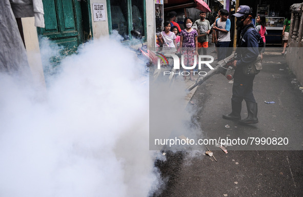 Health officials in the field of public environment carry out fumigation of the environment on residents in Grinding, Jakarta on March 29, 2...