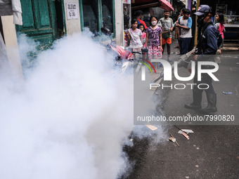 Health officials in the field of public environment carry out fumigation of the environment on residents in Grinding, Jakarta on March 29, 2...