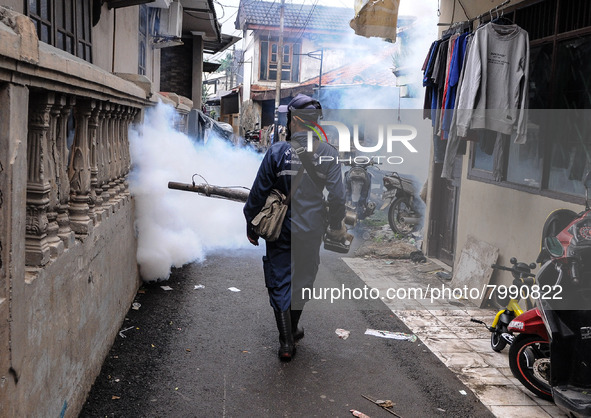 Health officials in the field of public environment carry out fumigation of the environment on residents in Grinding, Jakarta on March 29, 2...