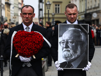 A photo of Polish composer and conductor Krzysztof Penderecki is carried during the funeral procession which walked through the Old Town in...