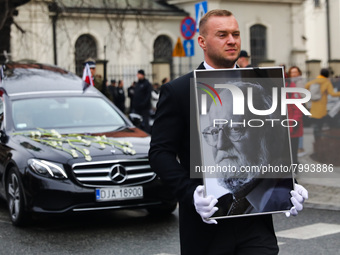 A photo of Polish composer and conductor Krzysztof Penderecki is carried during the funeral procession which walked through the Old Town in...