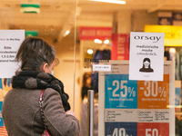 a retailer store with mask sign is seen in city center of Bonn, Germany on April 2, 2022 as many rules of covid 19 will be expired this week...