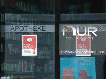 a apotheke with mask signs is seen in city center of Bonn, Germany on April 2, 2022 as many rules of covid 19 will be expired this weekend a...