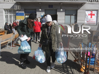 Ukrainian refugees who fled the war receive assistance at the city humanitarian volunteer center for helping refugees, amid Russia's invasio...