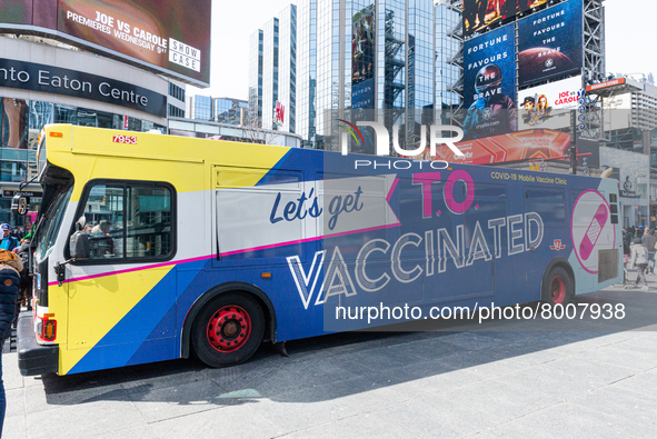 View at Bus for free vacination in Downtown Toronto, Canada. Mobile mobile clinics provide the opportunity to vaccinate everyone 