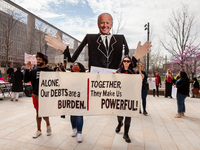 Students begin a march during an event demanding student debt cancellation at the Department of Education.  Hundreds of students took part i...