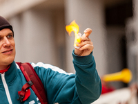 A student sets fire to a small piece of paper symbolizing his student debt during a rally to cancel all education debt at the Department of...