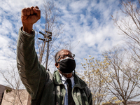 Irving Jones raises his fist in solidarity with students rallying to cancel their educational debt at the Department of Education.  Jones is...