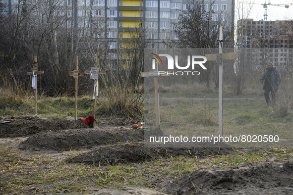 Graves with bodies of civilians next to apartments blocks in the recaptured by the Ukrainian army Bucha city near Kyiv, Ukraine, 04 April 20...