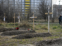 Graves with bodies of civilians next to apartments blocks in the recaptured by the Ukrainian army Bucha city near Kyiv, Ukraine, 04 April 20...