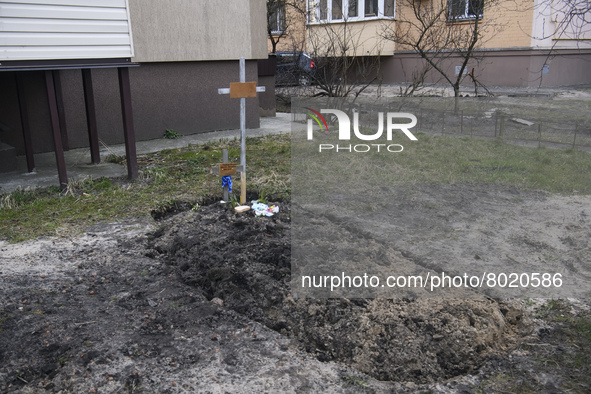 Graves with bodies of civilians next to apartments blocks in the recaptured by the Ukrainian army Bucha city near Kyiv, Ukraine, 04 April 20...