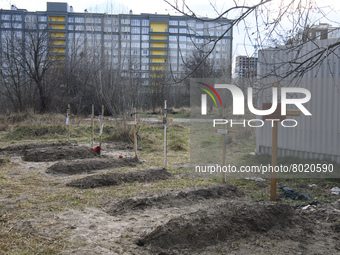 Graves with bodies of civilians next to apartments blocks in the recaptured by the Ukrainian army Bucha city near Kyiv, Ukraine, 04 April 20...