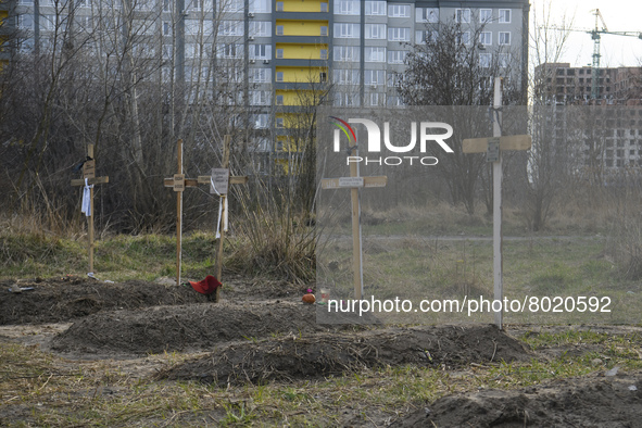 Graves with bodies of civilians next to apartments blocks in the recaptured by the Ukrainian army Bucha city near Kyiv, Ukraine, 04 April 20...