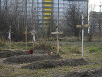 Graves with bodies of civilians next to apartments blocks in the recaptured by the Ukrainian army Bucha city near Kyiv, Ukraine, 04 April 20...