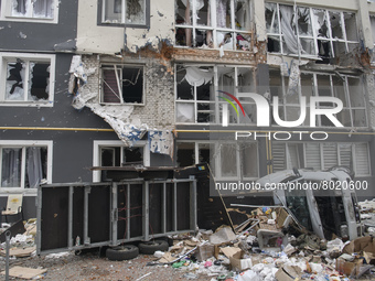 Destroyed civil vehicles  near a damaged residential building in the recaptured by the Ukrainian army Bucha city near Kyiv, Ukraine, 04 Apri...