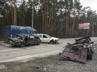 Destroyed civil vehicles  near a damaged residential building in the recaptured by the Ukrainian army Bucha city near Kyiv, Ukraine, 04 Apri...