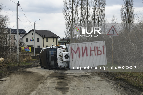 Destroyed civilian car with the inscription in Russian Mines  in the recaptured by the Ukrainian army Bucha city near Kyiv, Ukraine, 04 Apri...