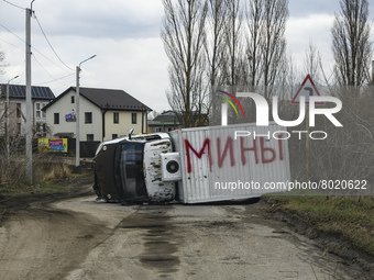 Destroyed civilian car with the inscription in Russian Mines  in the recaptured by the Ukrainian army Bucha city near Kyiv, Ukraine, 04 Apri...