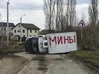 Destroyed civilian car with the inscription in Russian Mines  in the recaptured by the Ukrainian army Bucha city near Kyiv, Ukraine, 04 Apri...