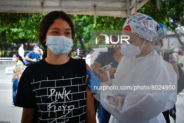 A health system personnel applies a dose of anti-Covid-19 vaccine to a child in the La Parada sector, near the city of Cucuta on the Colombi...