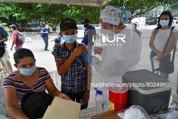 A health system personnel applies a dose of anti-Covid-19 vaccine to a child in the La Parada sector, near the city of Cucuta on the Colombi...