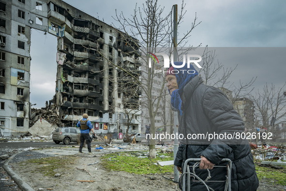 An old woman of Borodianka passes near a total destroyed building after the combats between the russian and ukrainian armies during the Russ...