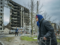 An old woman of Borodianka passes near a total destroyed building after the combats between the russian and ukrainian armies during the Russ...