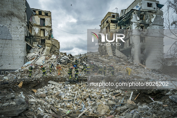 A rescue team clears debris of a destroyed building in Borodianka after the combats between the russian and ukrainian armies during the Russ...