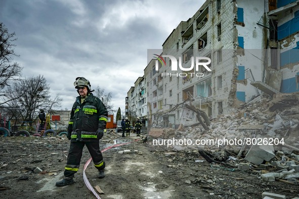 A member of a rescue team passes near a destroyed building after the clashes between the ukrainian and russian armies in Borodianka during t...