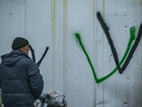 Graffities with the letter V, symbol of the russian troops during the occupation of the north part of Ukraine, in the city of Borodianka, af...