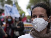 A large group of people in front of the Ministry of Health manifests itself in better conditions with boards and flags, on April 7, 2022, in...