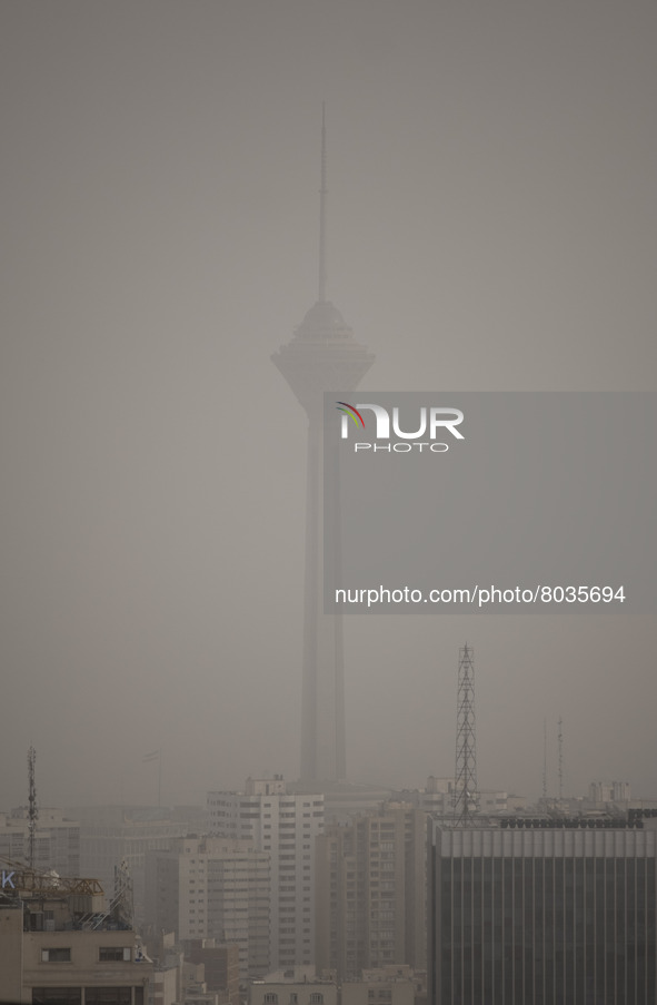 A view of northwestern Tehran and Milad telecommunication tower during a polluted air, on April 8, 2022. 