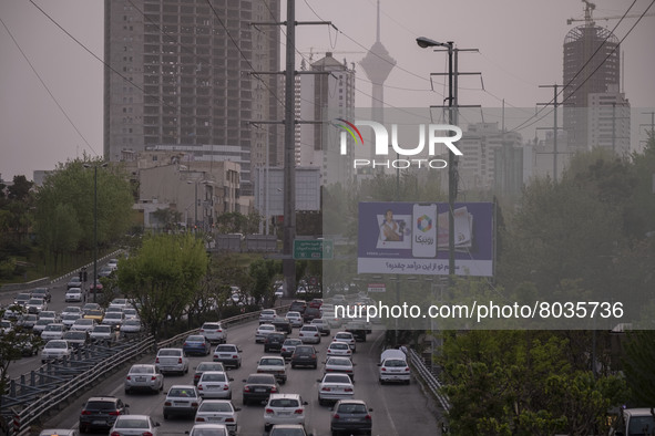 Vehicles drive along an expressway in Tehran during a polluted air, on April 8, 2022. 