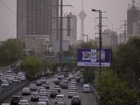 Vehicles drive along an expressway in Tehran during a polluted air, on April 8, 2022. (