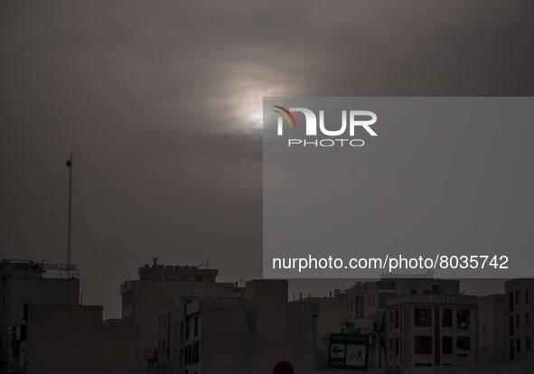 Sun shines over residential buildings in Tehran during a polluted air, on April 8, 2022. 