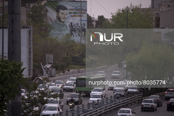 Vehicles drive along an expressway in Tehran during a polluted air, on April 8, 2022. 