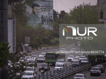 Vehicles drive along an expressway in Tehran during a polluted air, on April 8, 2022. (