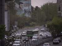 Vehicles drive along an expressway in Tehran during a polluted air, on April 8, 2022. (