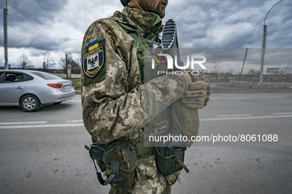 Ukrainian soldier controls a checkpoint in Chernihiv, Ukraine. 