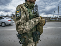 Ukrainian soldier controls a checkpoint in Chernihiv, Ukraine. (