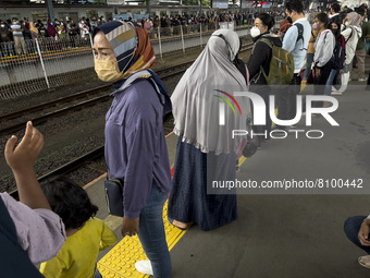 People at Tanah Abang Station, Jakarta, Indonesia, on April 20, 2022 amid the COVID-19 pandemic.(