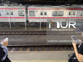 People at Tanah Abang Station, Jakarta, Indonesia, on April 20, 2022 amid the COVID-19 pandemic.(