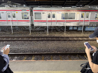 People at Tanah Abang Station, Jakarta, Indonesia, on April 20, 2022 amid the COVID-19 pandemic.(