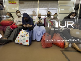 People at Tanah Abang Station, Jakarta, Indonesia, on April 20, 2022 amid the COVID-19 pandemic.(