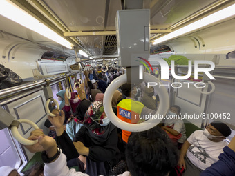 People at Tanah Abang Station, Jakarta, Indonesia, on April 20, 2022 amid the COVID-19 pandemic.(