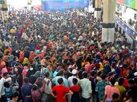 People queue to buy advance tickets for Eid train trips at Dhaka's Kamalapur Railway Station on Sunday, Apr 24, 2022. Tickets are being sold...