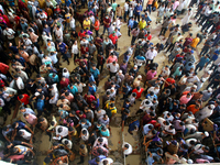 People queue to buy advance tickets for Eid train trips at Dhaka's Kamalapur Railway Station on Sunday, Apr 24, 2022. Tickets are being sold...